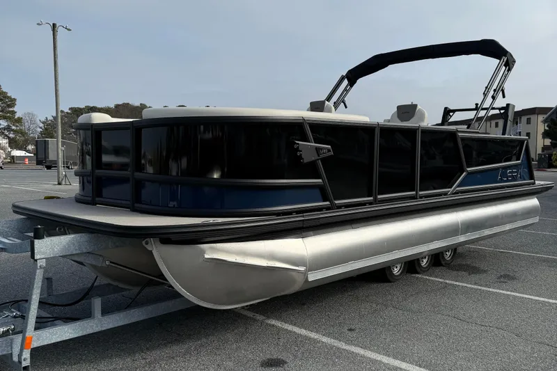 Slide: The Image of 2026 Alera M23L pontoon boat on trailer in parking lot. - 4