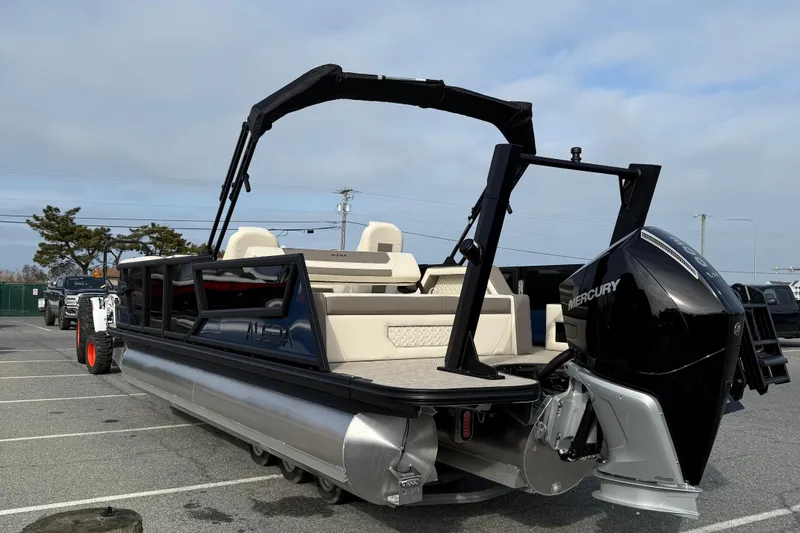 Slide: The Image of 2026 Alera M23L pontoon boat with Mercury engine in parking lot. - 6