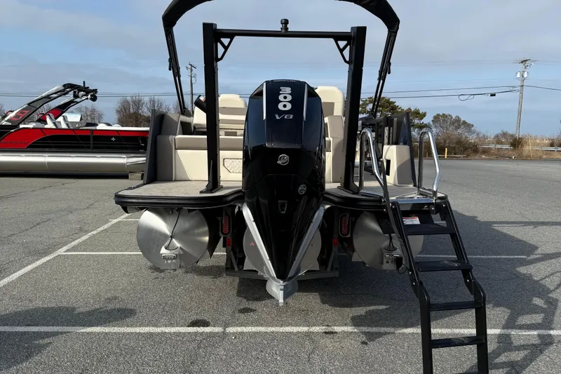 Slide: The Image of 2026 Alera M23L boat with 300 V8 engine, parked on asphalt. - 7