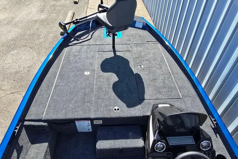 Slide: The Image of 2026 Lowe Stinger 195 Bass boat interior with carpeted deck and fishing seat. - 3