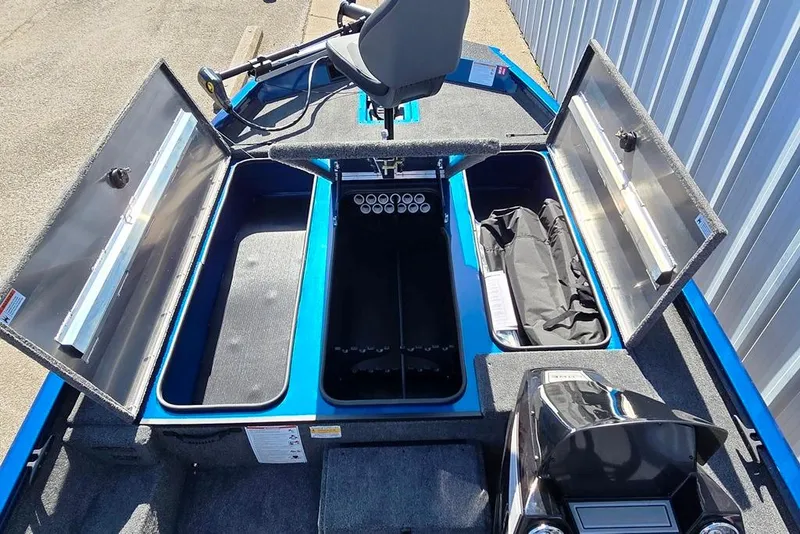 Slide: The Image of 2026 Lowe Stinger 195 Bass boat interior with open storage compartments and seating. - 5