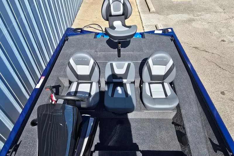 Slide: The Image of 2026 Lowe Stinger 195 Bass boat interior with gray seating and steering console. - 6