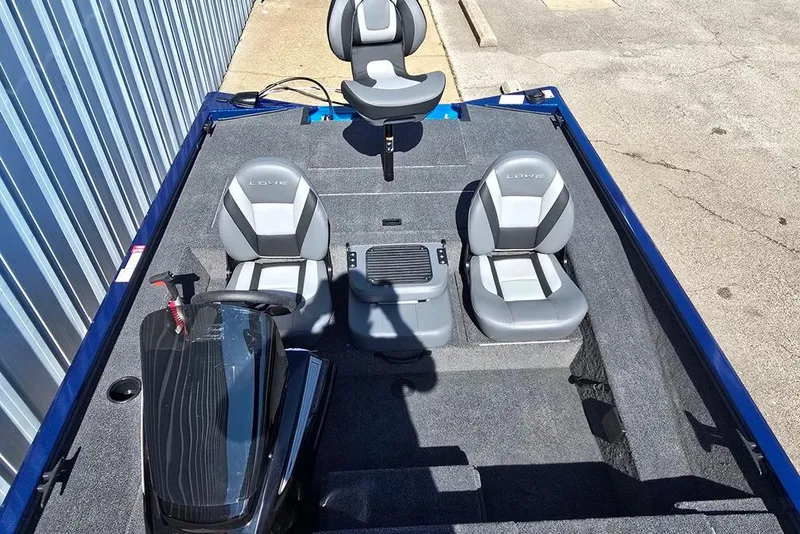 Slide: The Image of 2026 Lowe Stinger 195 Bass boat interior with three gray seats and steering console. - 7