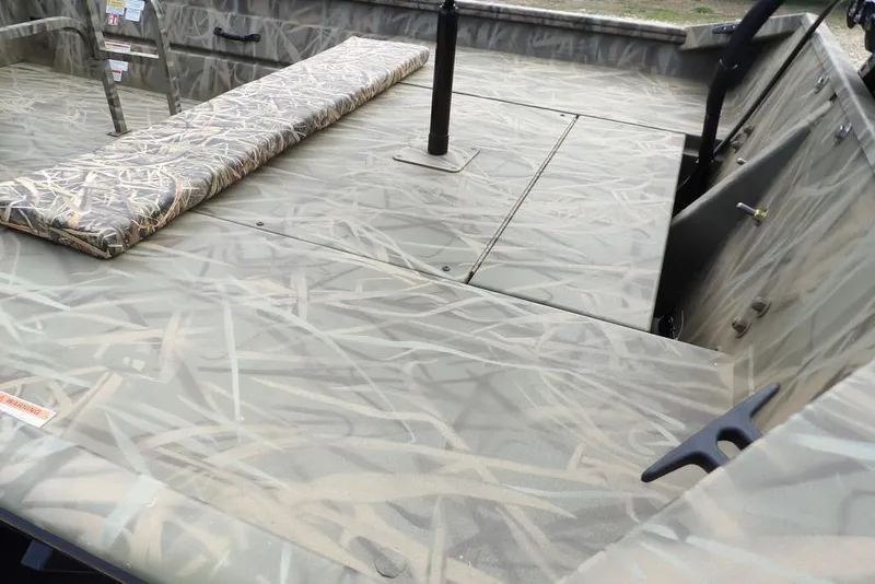 Slide: The Image of 2026 Crestliner 1870 Retriever FCC boat interior with camouflage design and seating. - 12