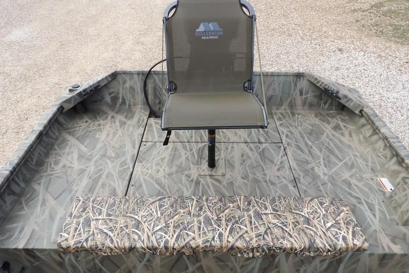 Slide: The Image of 2026 Crestliner 1870 Retriever FCC boat with camouflage seating and flooring. - 13