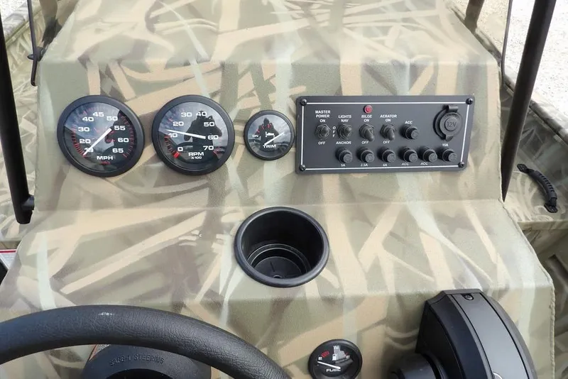 Slide: The Image of Dashboard of 2026 Crestliner 1870 Retriever FCC boat with gauges and controls. - 16