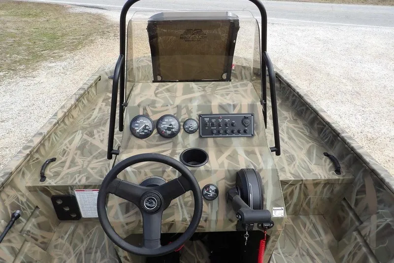 Slide: The Image of 2026 Crestliner 1870 Retriever FCC boat interior with camouflage design and control panel. - 18