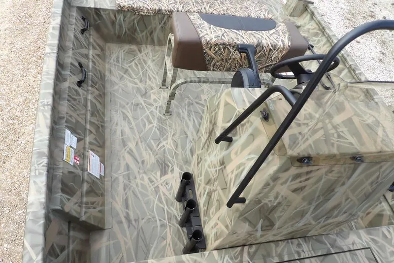 Slide: The Image of 2026 Crestliner 1870 Retriever FCC boat interior with camouflage design and seating. - 22