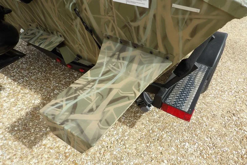 Slide: The Image of 2026 Crestliner 1870 Retriever FCC boat with camouflage design on a trailer. - 28