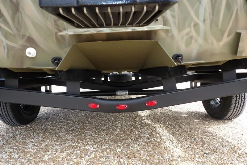 Slide: The Image of 2026 Crestliner 1870 Retriever FCC boat trailer with camouflage design and red lights. - 29