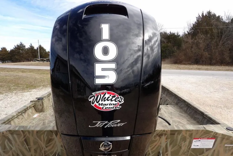 Slide: The Image of 2026 Crestliner 1870 Retriever FCC with 105 JetPower engine, outdoors near trees. - 30