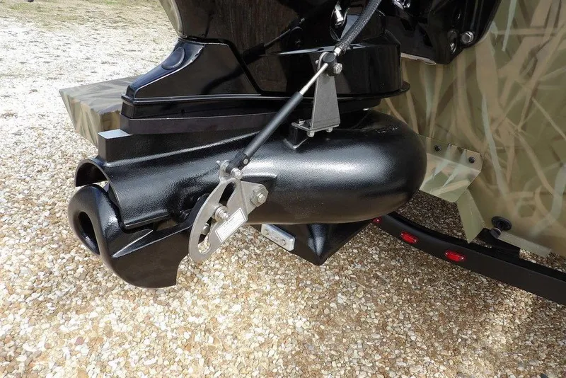 Slide: The Image of Outboard motor of 2026 Crestliner 1870 Retriever FCC on gravel surface. - 31