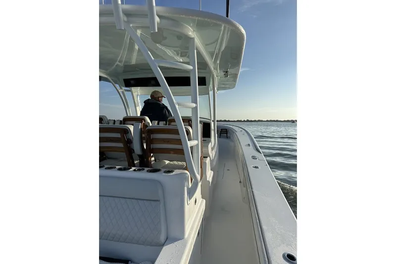 Slide: The Image of 2025 Valhalla Boatworks V-46 cruising on calm waters at sunrise. - 12