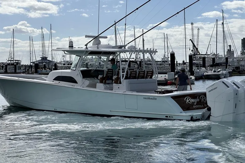 Slide: The Image of 2025 Valhalla Boatworks V-46 in marina, featuring sleek design and powerful engines. - 20