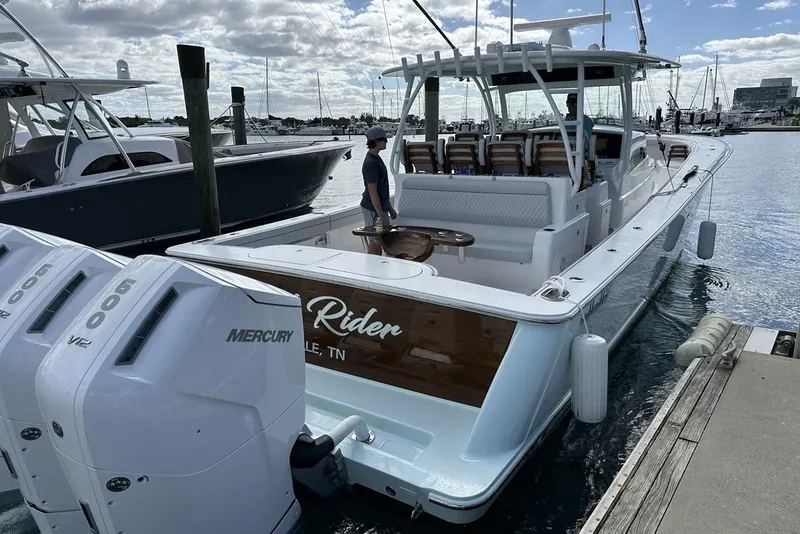 Slide: The Image of 2025 Valhalla Boatworks V-46 docked, featuring triple Mercury engines and spacious seating. - 3