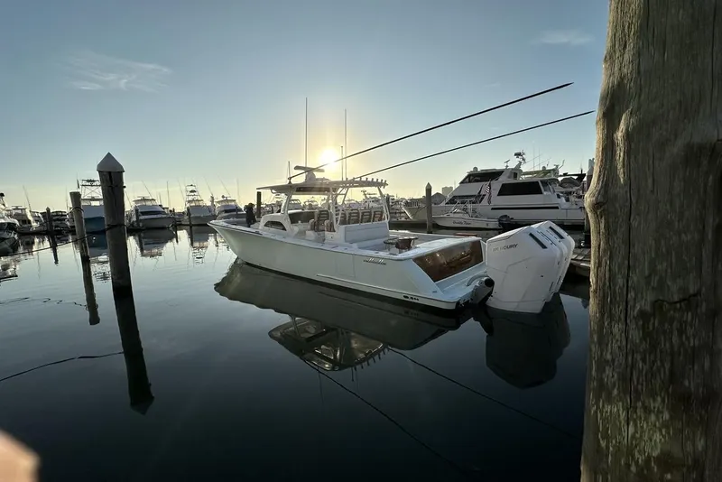 Slide: The Image of 2025 Valhalla Boatworks V-46 docked at marina during sunset. - 5