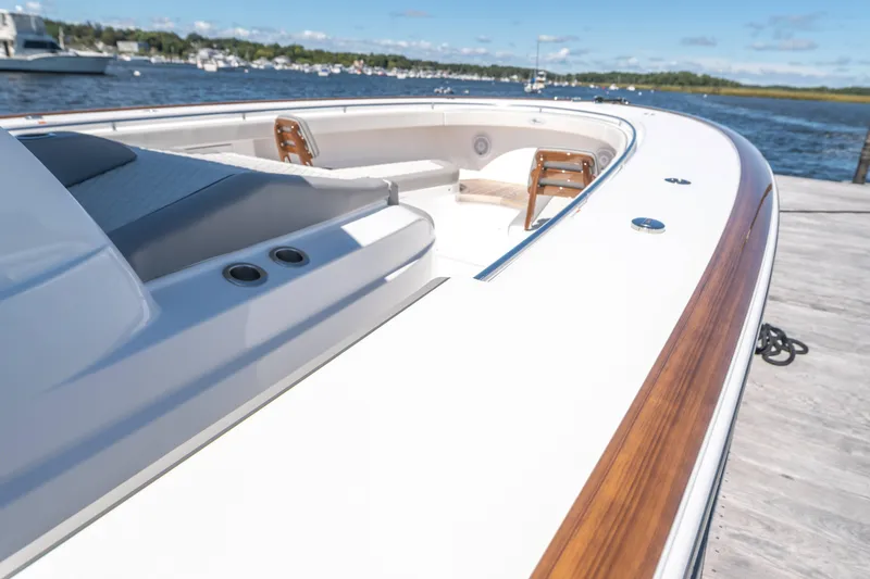 Slide: The Image of 2025 Valhalla Boatworks V-46, sleek design, docked by the water. - 6