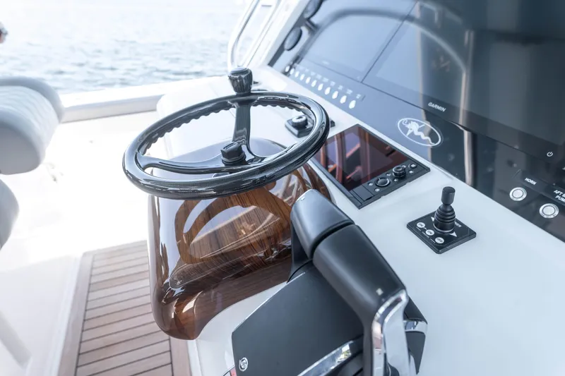 Slide: The Image of 2025 Valhalla Boatworks V-46 helm with modern controls and sleek design. - 8