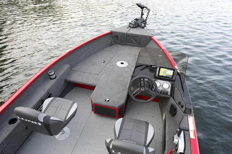 Slide: The Image of Manufacturer Provided Image: 2026 Lund 1775 Adventure SS boat interior with steering console and seating on water. - 6