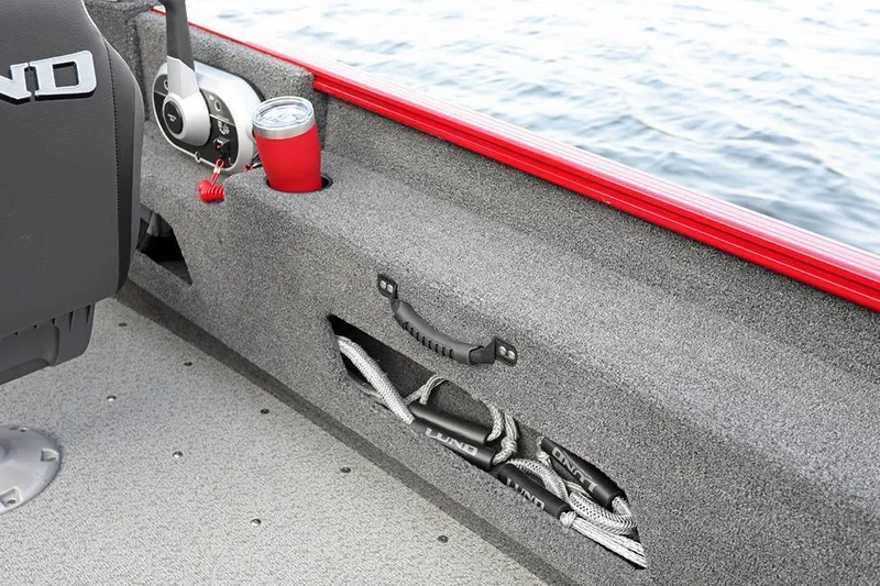 Slide: The Image of Manufacturer Provided Image: Interior of 2026 Lund 1775 Adventure SS boat with storage and cup holder. - 7