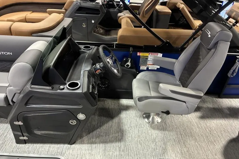 Slide: The Image of 2026 Bennington 23 S Swingback boat interior with modern helm and comfortable seating. - 2