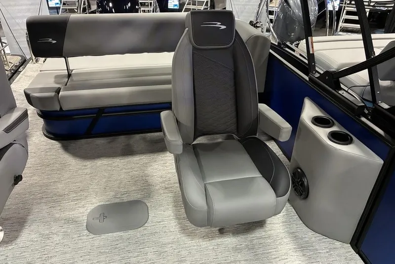 Slide: The Image of 2026 Bennington 23 S Swingback boat interior with gray seating and cup holders. - 3