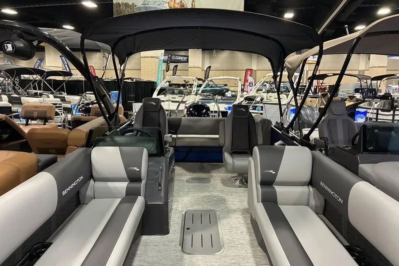 Slide: The Image of 2026 Bennington 23 S Swingback pontoon boat interior at a boat show. - 5