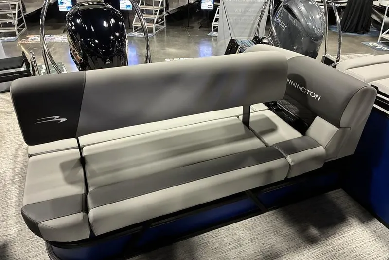 Slide: The Image of 2026 Bennington 23 S Swingback boat seating, gray upholstery, displayed indoors. - 6