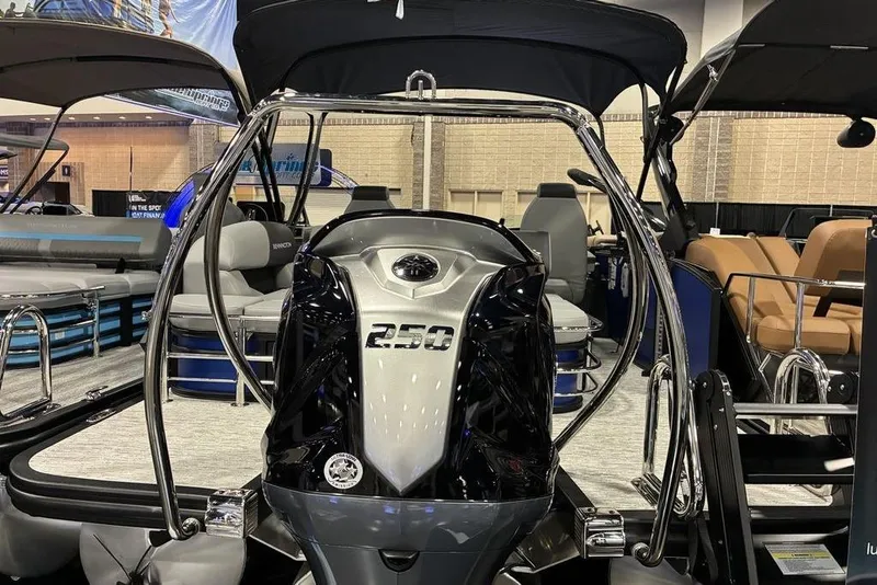 Slide: The Image of 2026 Bennington 23 S Swingback pontoon boat with powerful 250 engine, showcased indoors. - 7