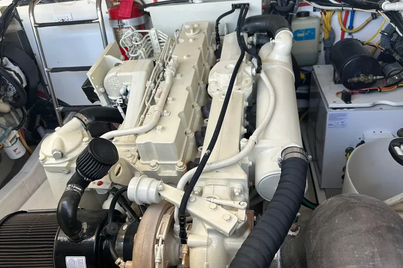 Slide: The Image of Engine compartment of a 2005 Tiara Yachts 3800 Open, showcasing detailed machinery. - 14