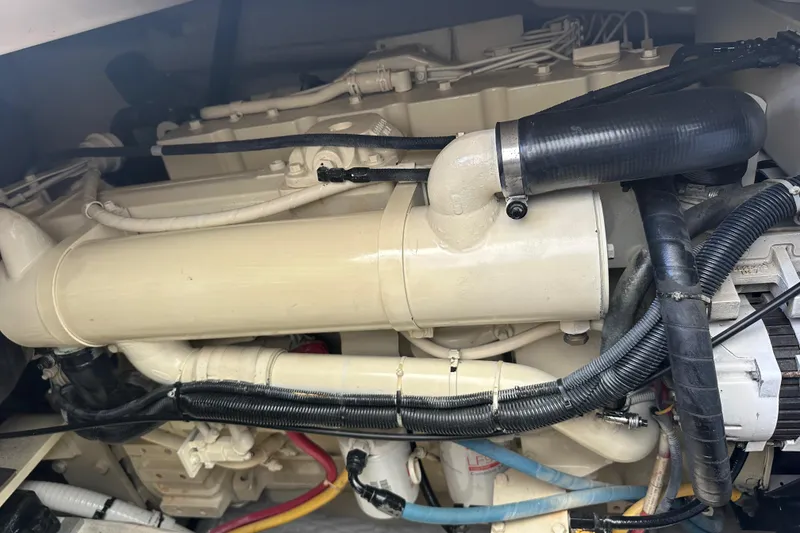 Slide: The Image of Engine compartment of a 2005 Tiara Yachts 3800 Open, showcasing detailed components and wiring. - 15