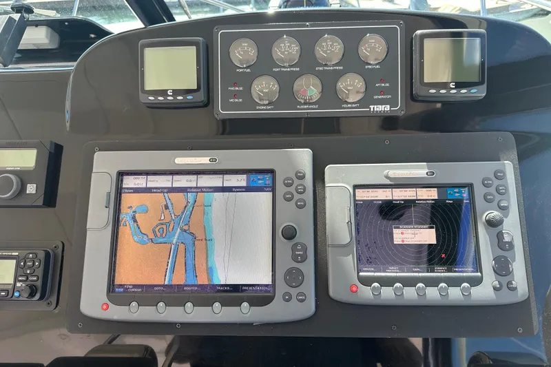 Slide: The Image of Dashboard of a 2005 Tiara Yachts 3800 Open with navigation and control systems. - 7