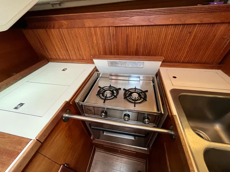 Slide: The Image of 1988 Sabre 34 MK II yacht galley with stove and sink. - 12