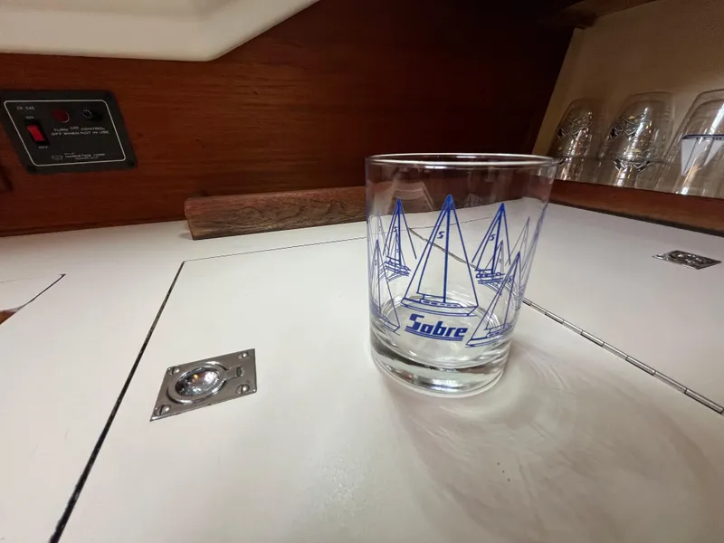 Slide: The Image of Sabre 34 MK II glass with sailboat design on boat table, 1988. - 15