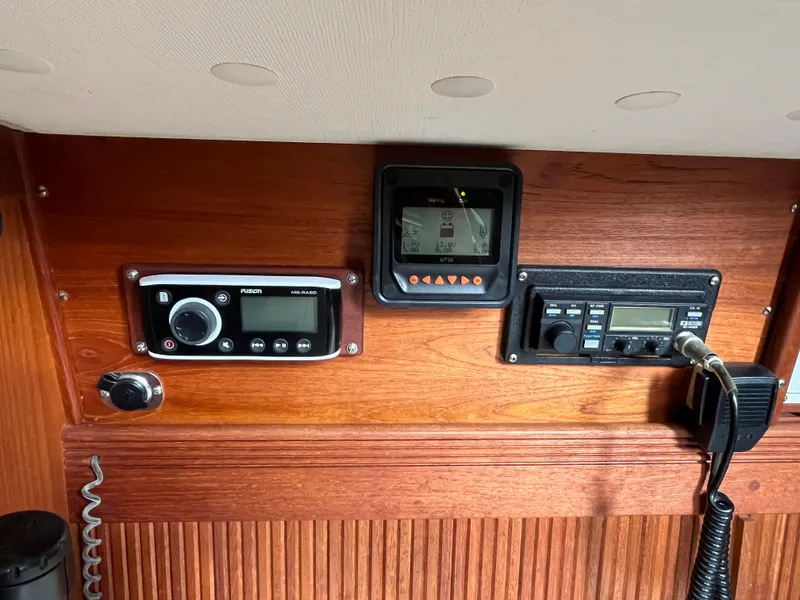 Slide: The Image of 1988 Sabre 34 MK II boat control panel with radio and navigation equipment. - 18