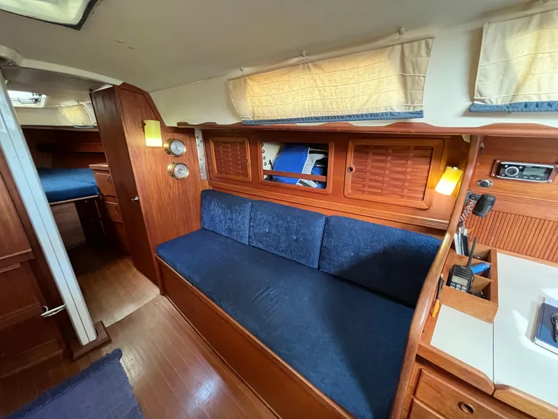 Slide: The Image of Interior of a 1988 Sabre 34 MK II yacht with blue upholstery. - 23