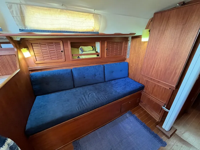 Slide: The Image of Interior of a 1988 Sabre 34 MK II yacht with blue upholstery. - 24
