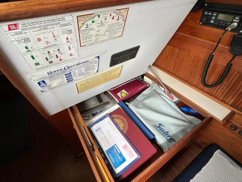 Slide: The Image of Interior of Sabre 34 MK II yacht, drawer with charts and manuals. - 30