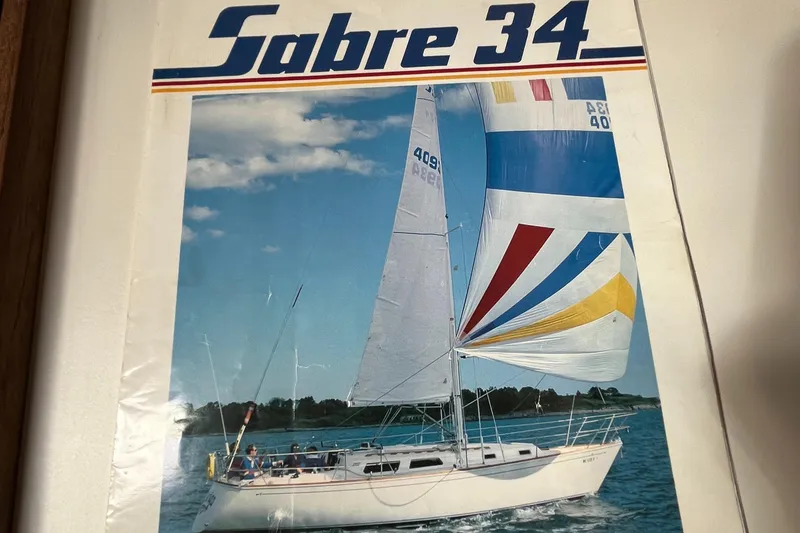 Slide: The Image of 1988 Sabre 34 MK II sailboat on water with colorful spinnaker. - 31