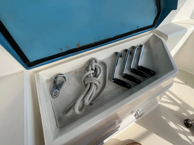 Slide: The Image of Storage compartment on 1988 Sabre 34 MK II with rope and fittings. - 36