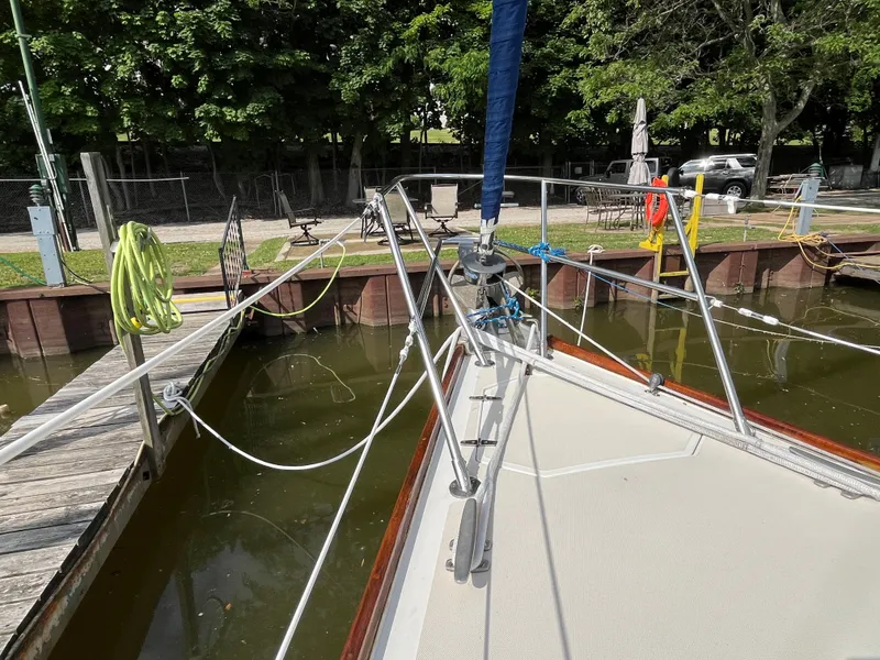Slide: The Image of Bow of a 1988 Sabre 34 MK II sailboat docked in harbor. - 42