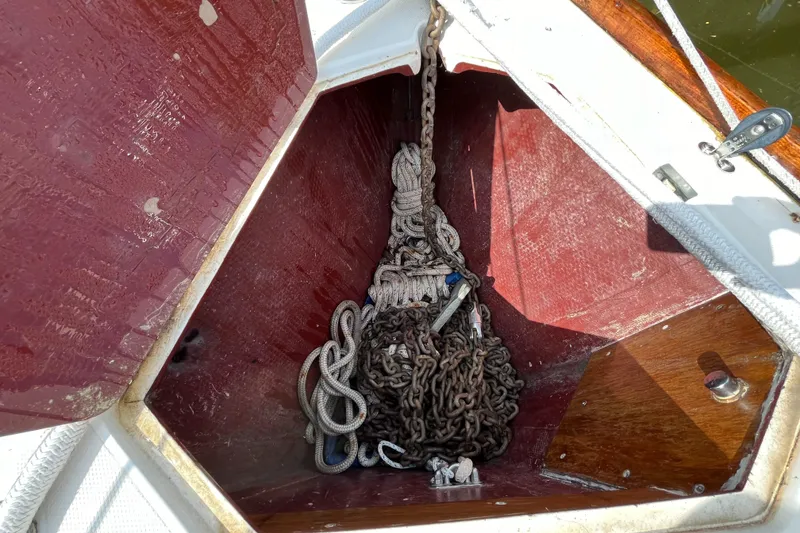 Slide: The Image of Anchor locker of 1988 Sabre 34 MK II with chain and rope. - 44