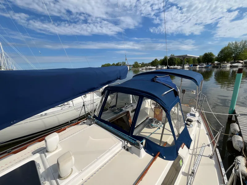 Slide: The Image of 1988 Sabre 34 MK II sailboat docked under sunny skies. - 48