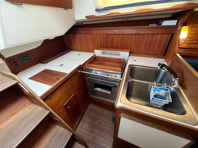 Slide: The Image of 1988 Sabre 34 MK II yacht kitchen interior with wood finish. - 8