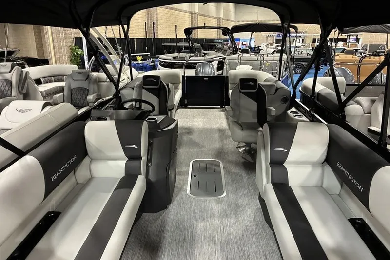 Slide: The Image of 2026 Bennington S Quad Bench 22 SSR SPS pontoon boat interior with luxurious seating. - 3