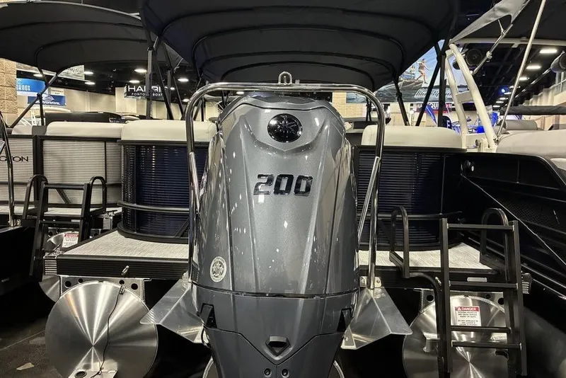 Slide: The Image of 2026 Bennington S Quad Bench 22 SSR SPS pontoon boat with powerful 200 HP engine. - 6
