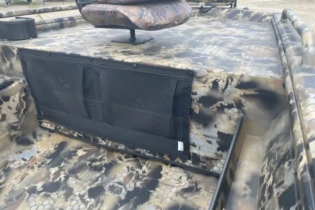 Slide: The Image of 2026 Excel 1751 Viper F4 boat interior with camouflage design and seating. - 4