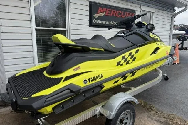 Slide: The Image of 2023 Yamaha WaveRunner VX Cruiser HO in vibrant yellow on a trailer. - 2