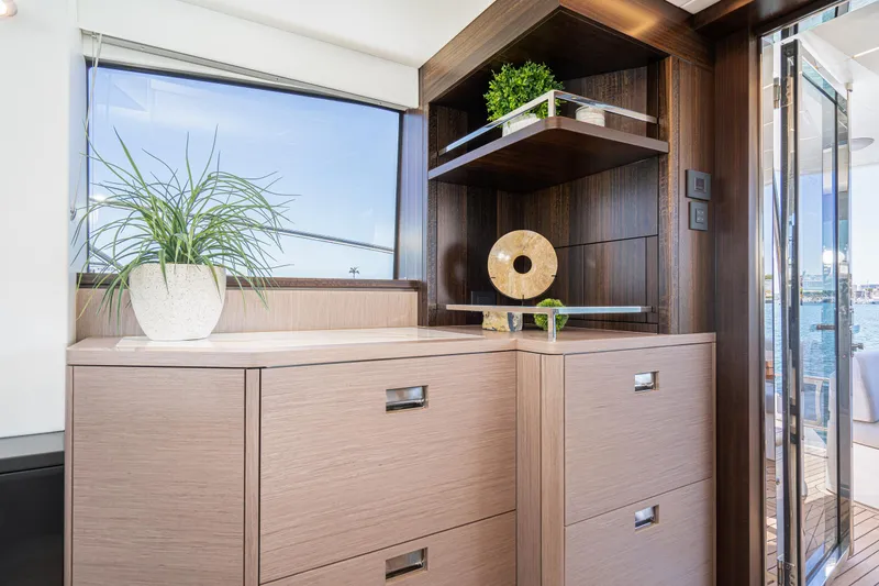 Slide: The Image of Interior of 2021 Sunseeker Manhattan 55 yacht with modern wooden cabinetry and decor. - 12