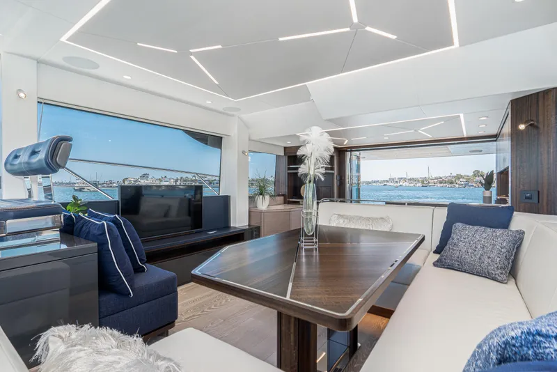 Slide: The Image of Luxurious interior of 2021 Sunseeker Manhattan 55 yacht with modern furnishings and panoramic windows. - 13